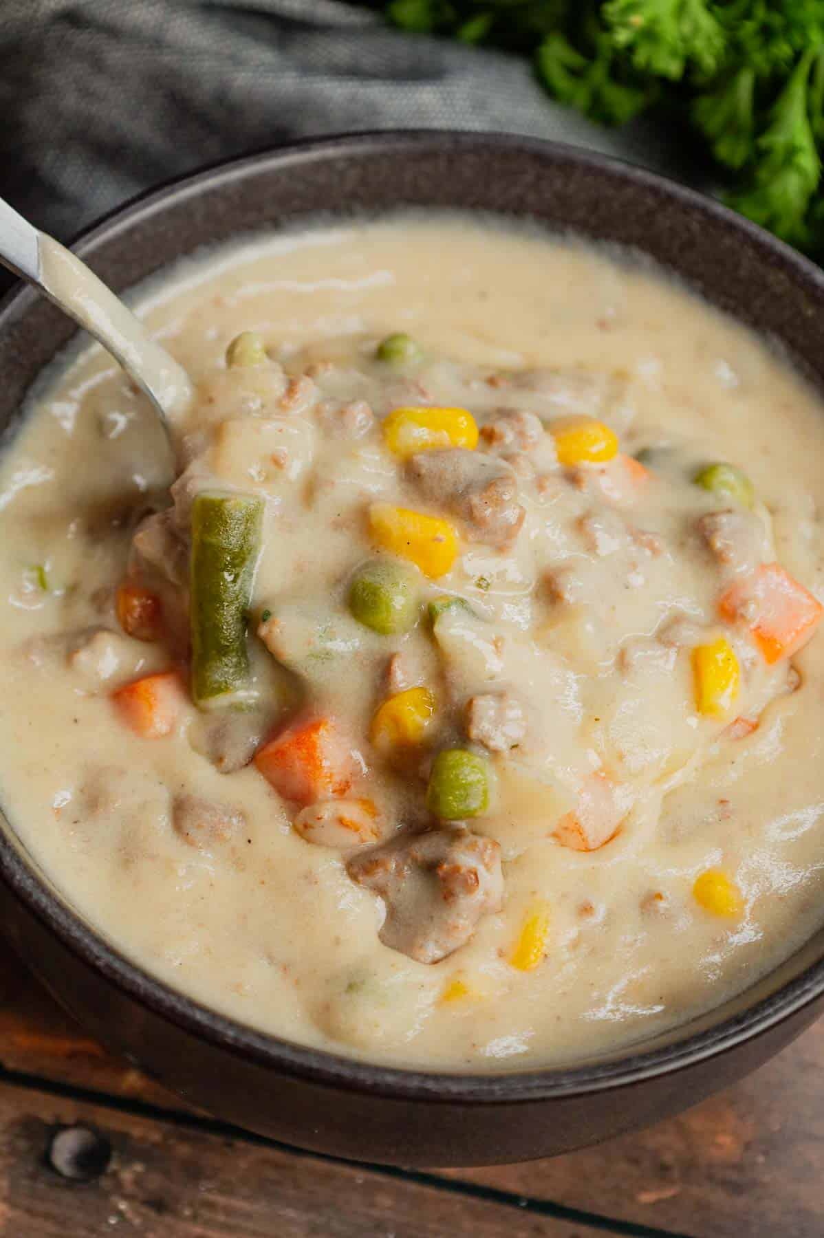 Shepherd's Pie Soup is a hearty soup loaded with instant mashed potatoes, ground beef, chicken broth, half and half, diced onions and frozen mixed vegetables.