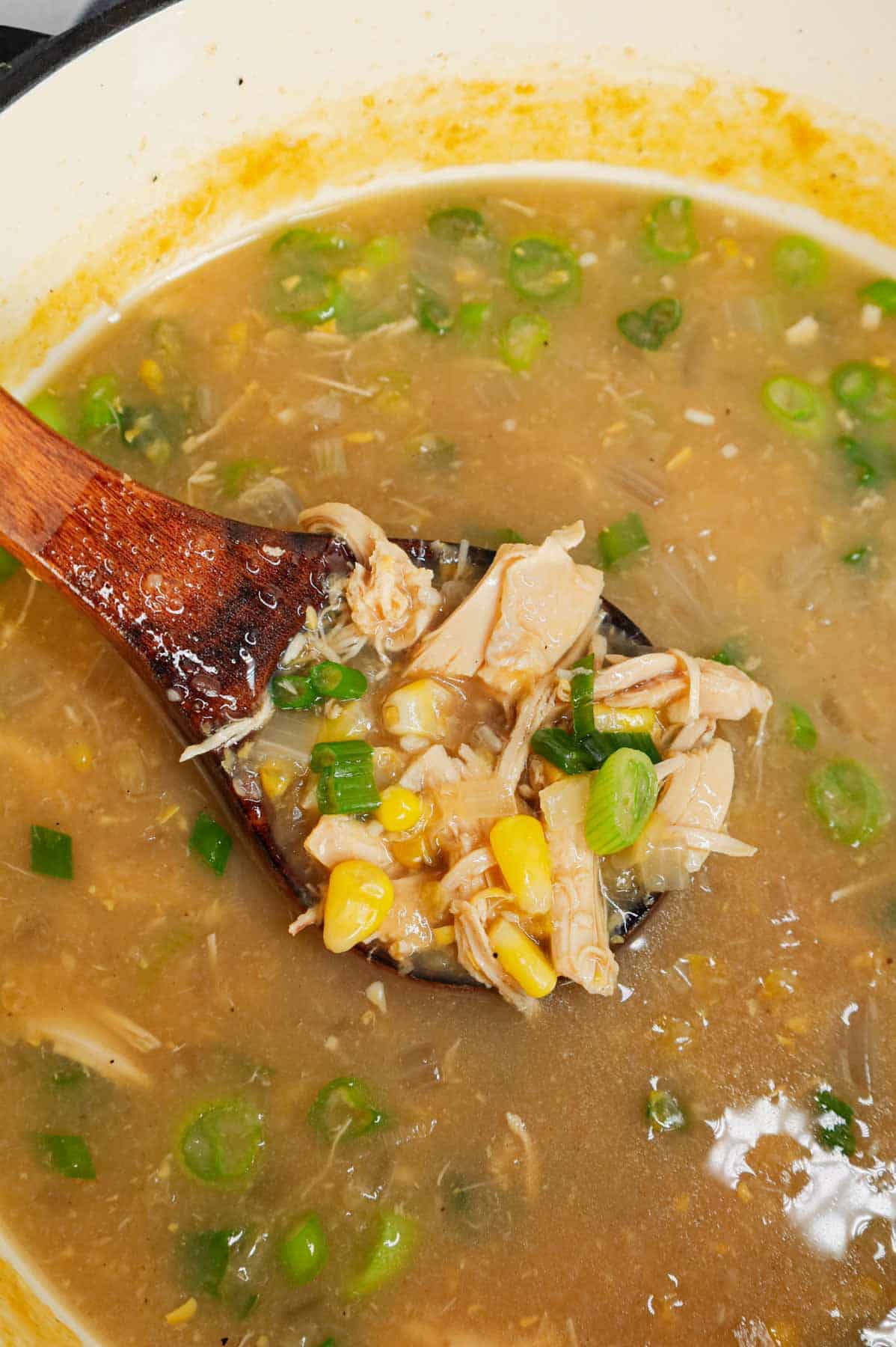 Sweet Corn Chicken Soup is a hearty soup recipe loaded with shredded chicken, corn kernels, cream style corn, minced garlic, minced ginger, soy sauce and green onions all in a tasty broth.