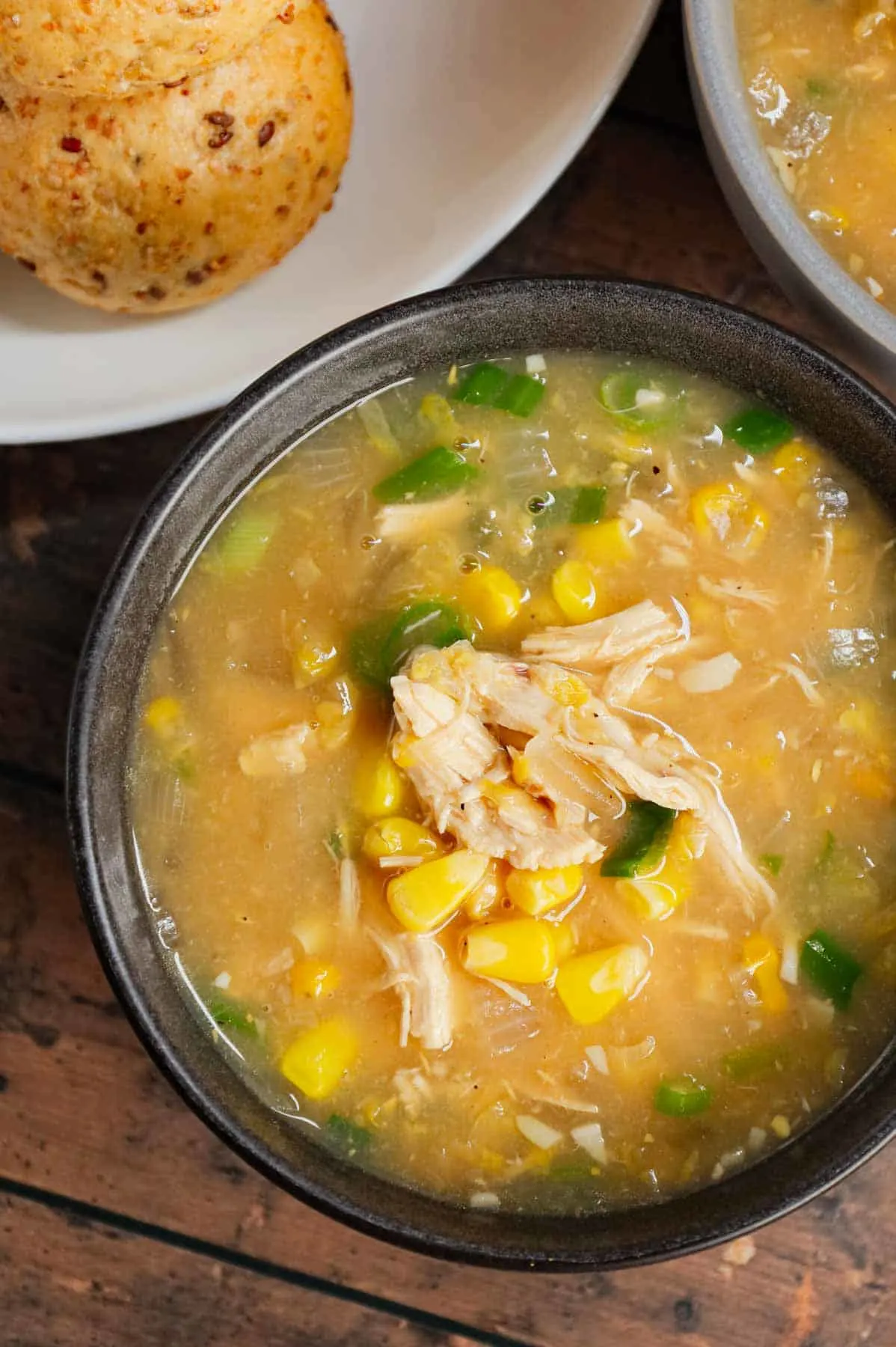 Sweet Corn Chicken Soup is a hearty soup recipe loaded with shredded chicken, corn kernels, cream style corn, minced garlic, minced ginger, soy sauce and green onions all in a tasty broth.