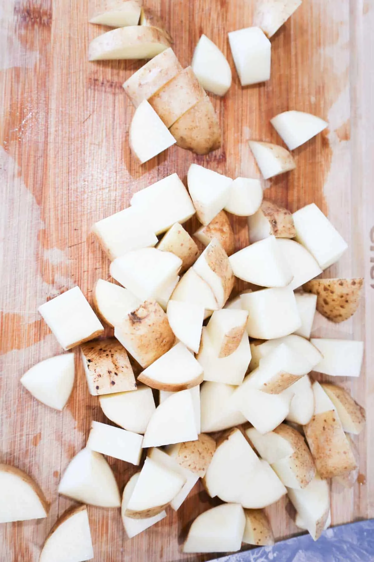 chopped russet potatoes on cutting board