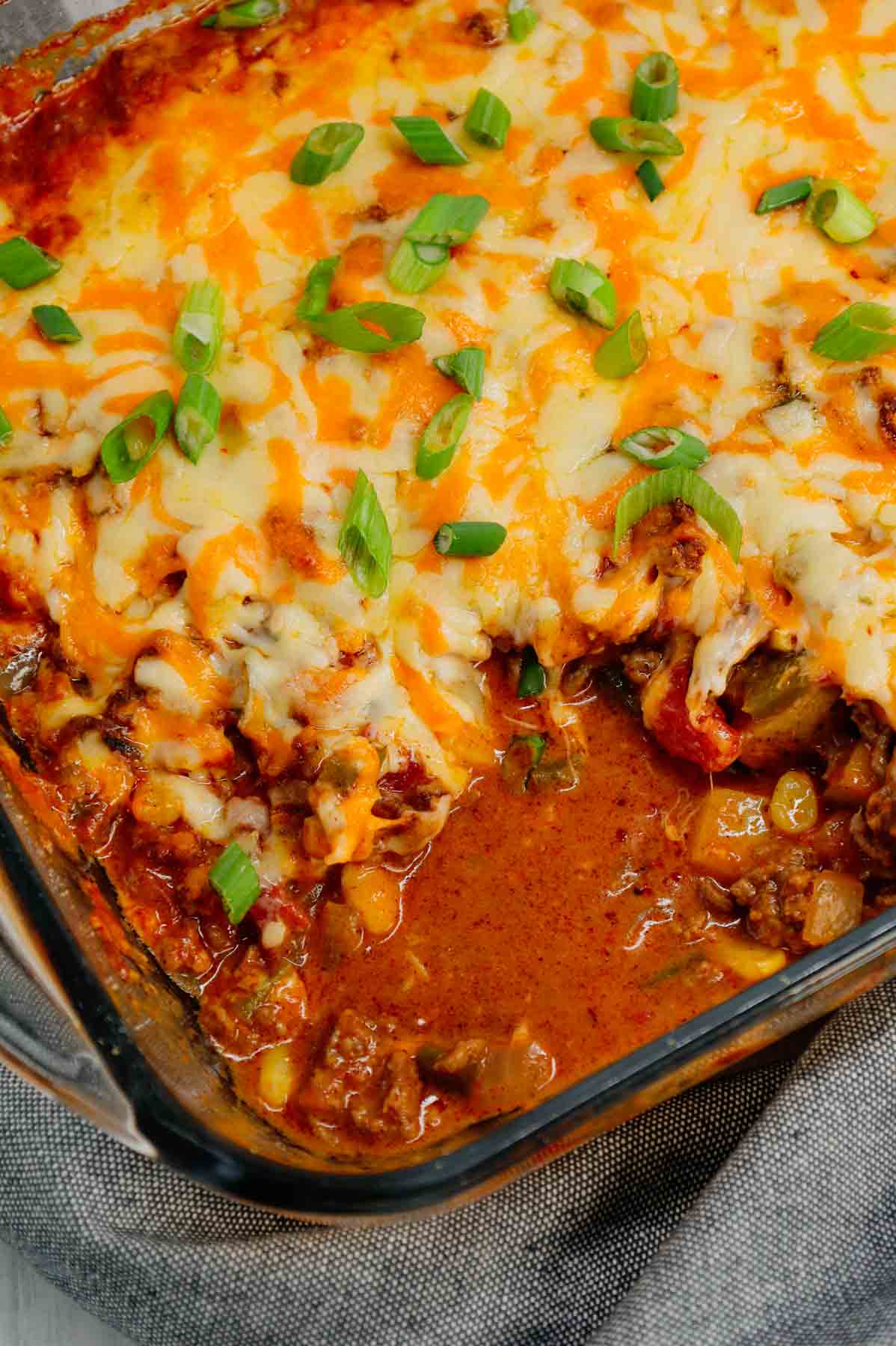 Taco Potato Casserole is a hearty dinner loaded with cubed russet potatoes, ground beef, onions, green bell peppers, Rotel diced tomatoes, salsa, taco seasoning, cheddar soup and shredded cheese.