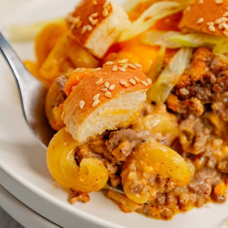 Big Mac Pasta is a hearty baked pasta recipe loaded with ground beef, diced onions, pickles, sesame seeds, Thousand Island dressing and cheddar cheese and topped with chopped hamburger buns and shredded lettuce.