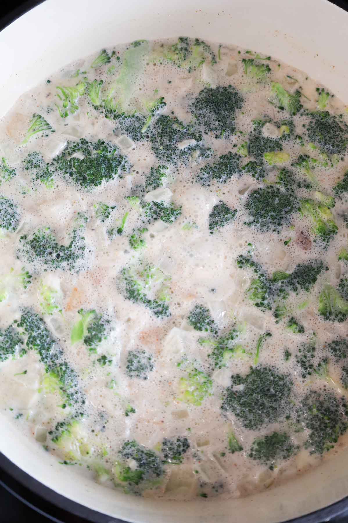 broccoli potato soup simmering in a pot