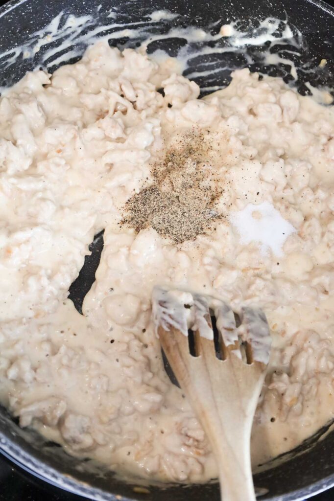 salt and pepper added to skillet with creamy chicken mixture.