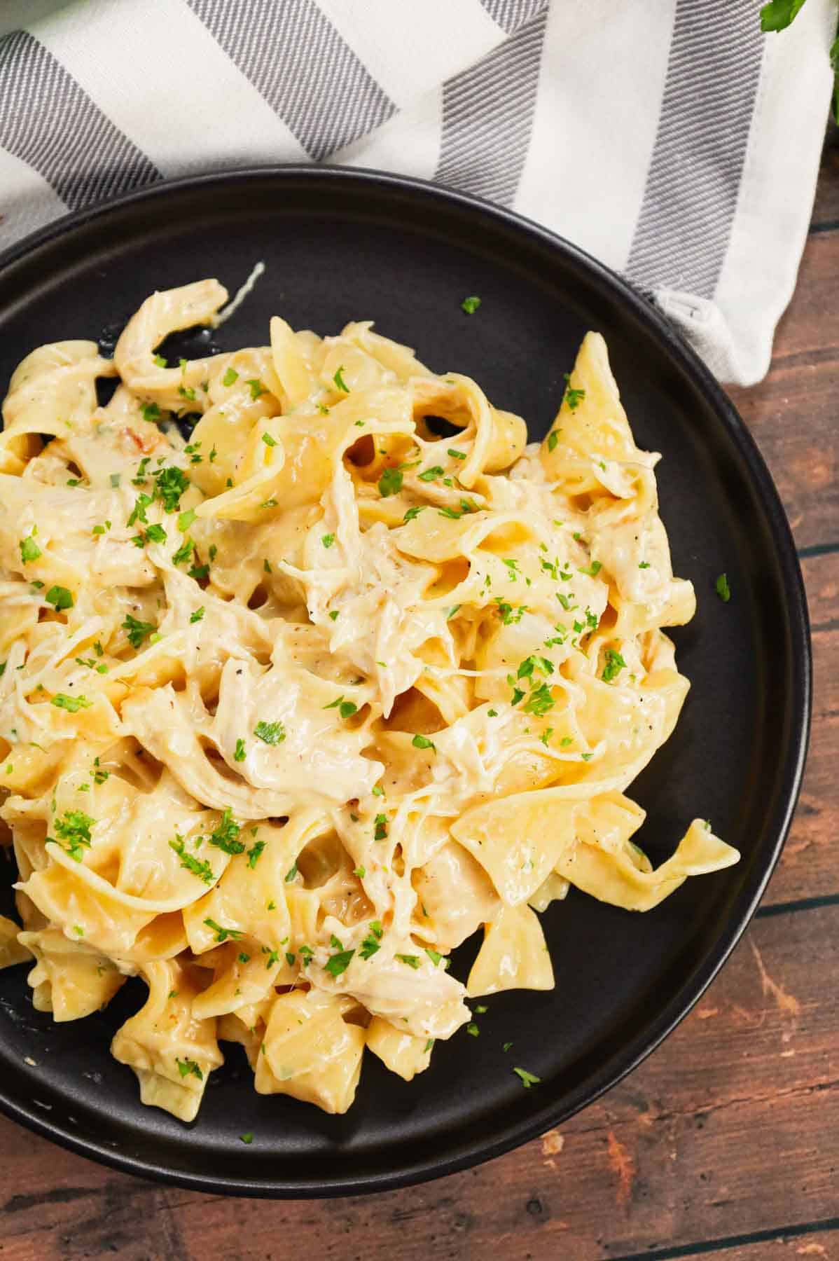 Chicken and Egg Noodles is a simple comfort food dish made with shredded rotisserie chicken, extra broad egg noodles, diced onion, cream of chicken soup and milk.