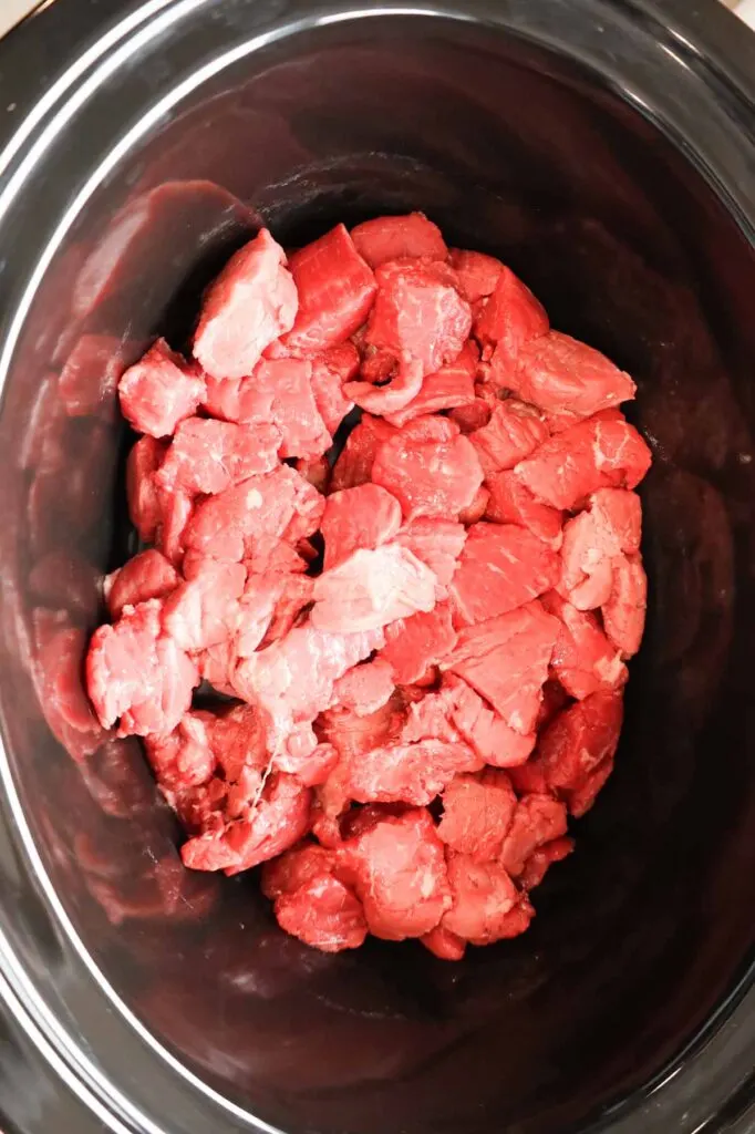 raw stewing beef in a Crock Pot