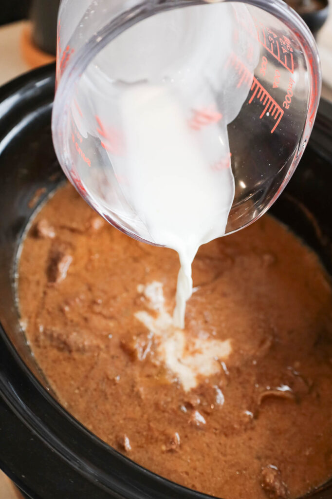 pouring cornstarch slurry into crock pot