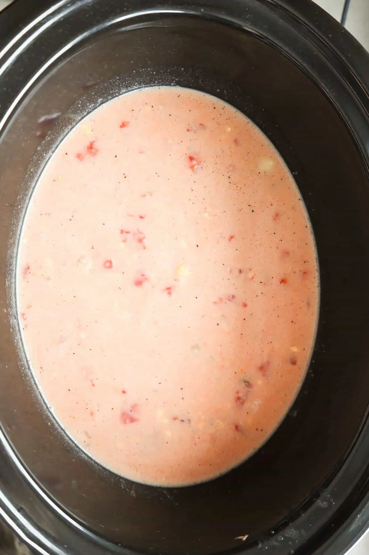 milk, broth, tomato and cheese soup mixture in a crock pot