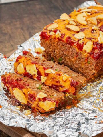 Ritz Cracker Meatloaf is a delicious ground beef meatloaf loaded with crushed Ritz crackers, onion soup mix, onions, green bell peppers and cheddar cheese.
