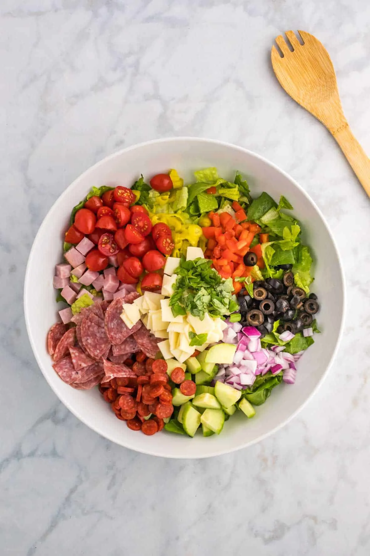 Italian sub salad ingredients in a large bowl