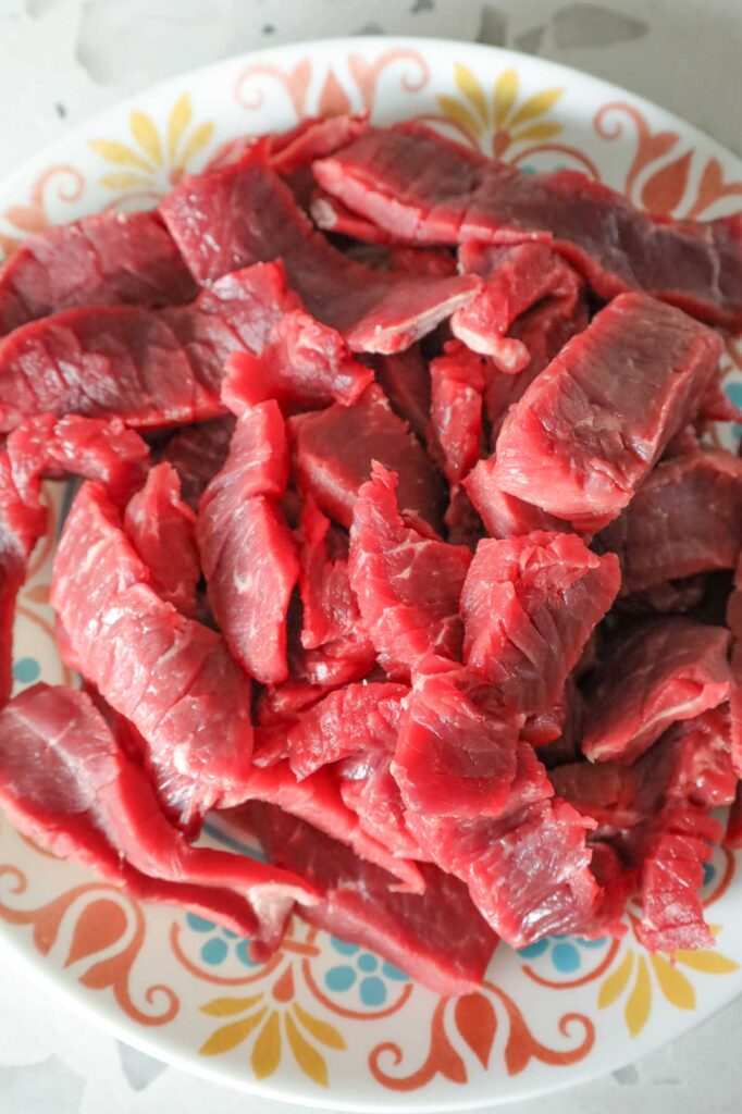 sliced steak strips on a plate
