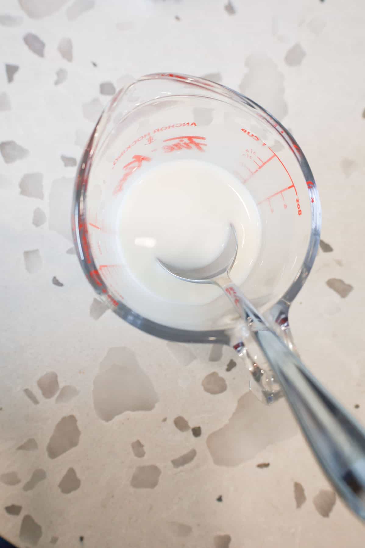 cornstarch slurry in a glass measuring cup