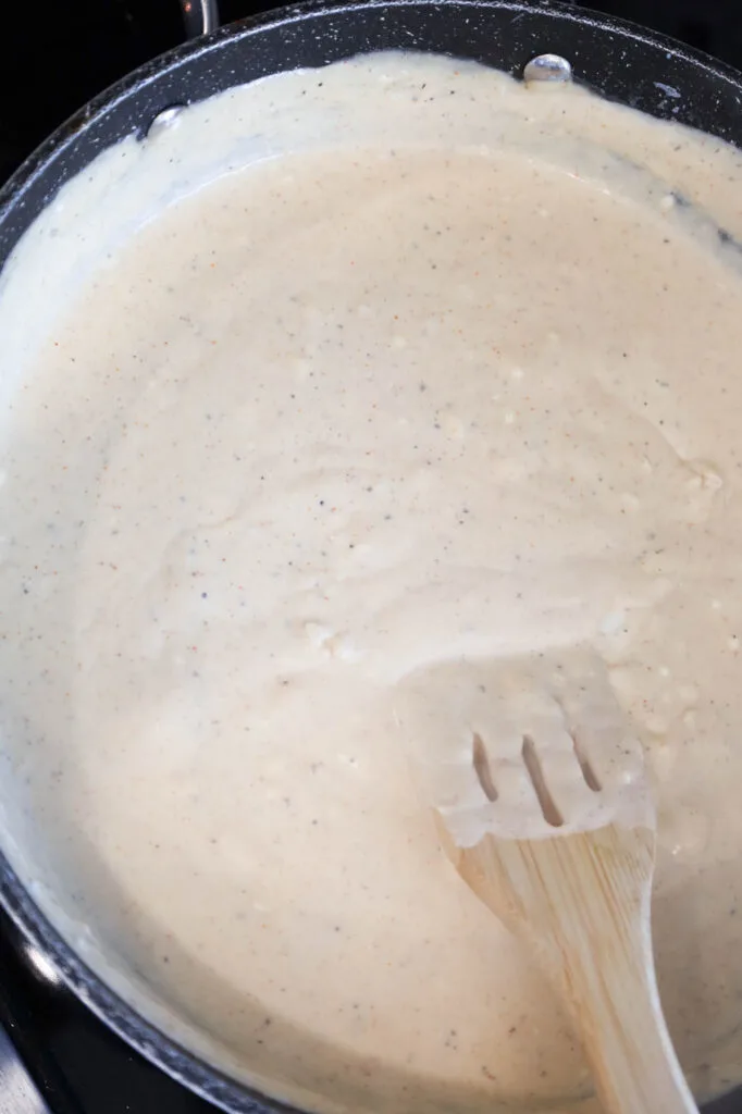 cream sauce cooking in a skillet
