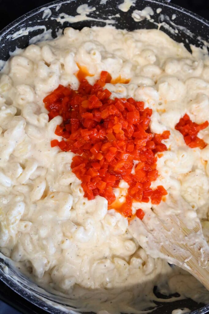 diced pimentos added to skillet with creamy pasta