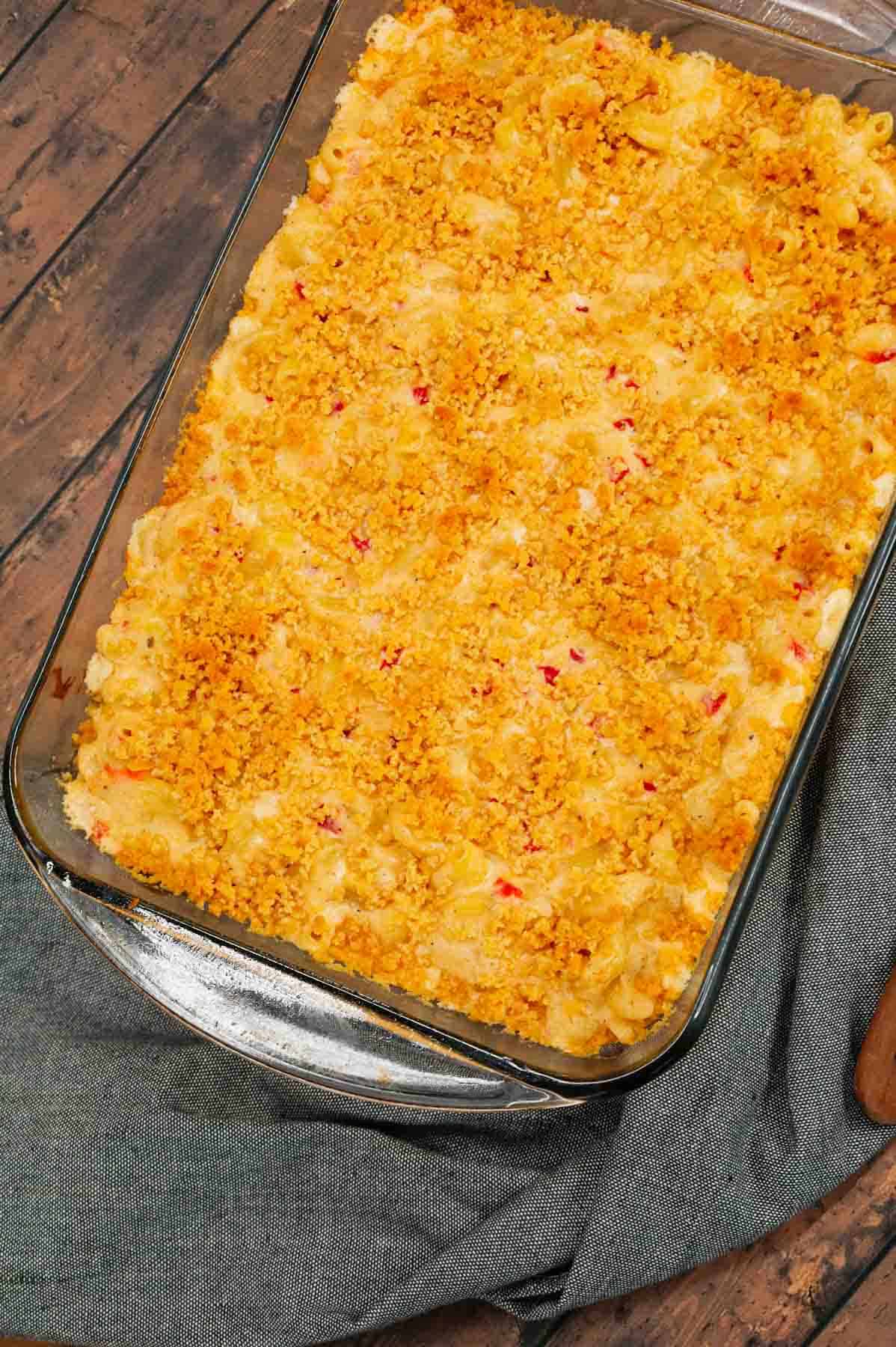 Pimento Mac and Cheese is a delicious creamy pasta recipe loaded with white cheddar, cream cheese and diced pimentos and baked with a buttery Ritz cracker topping.
