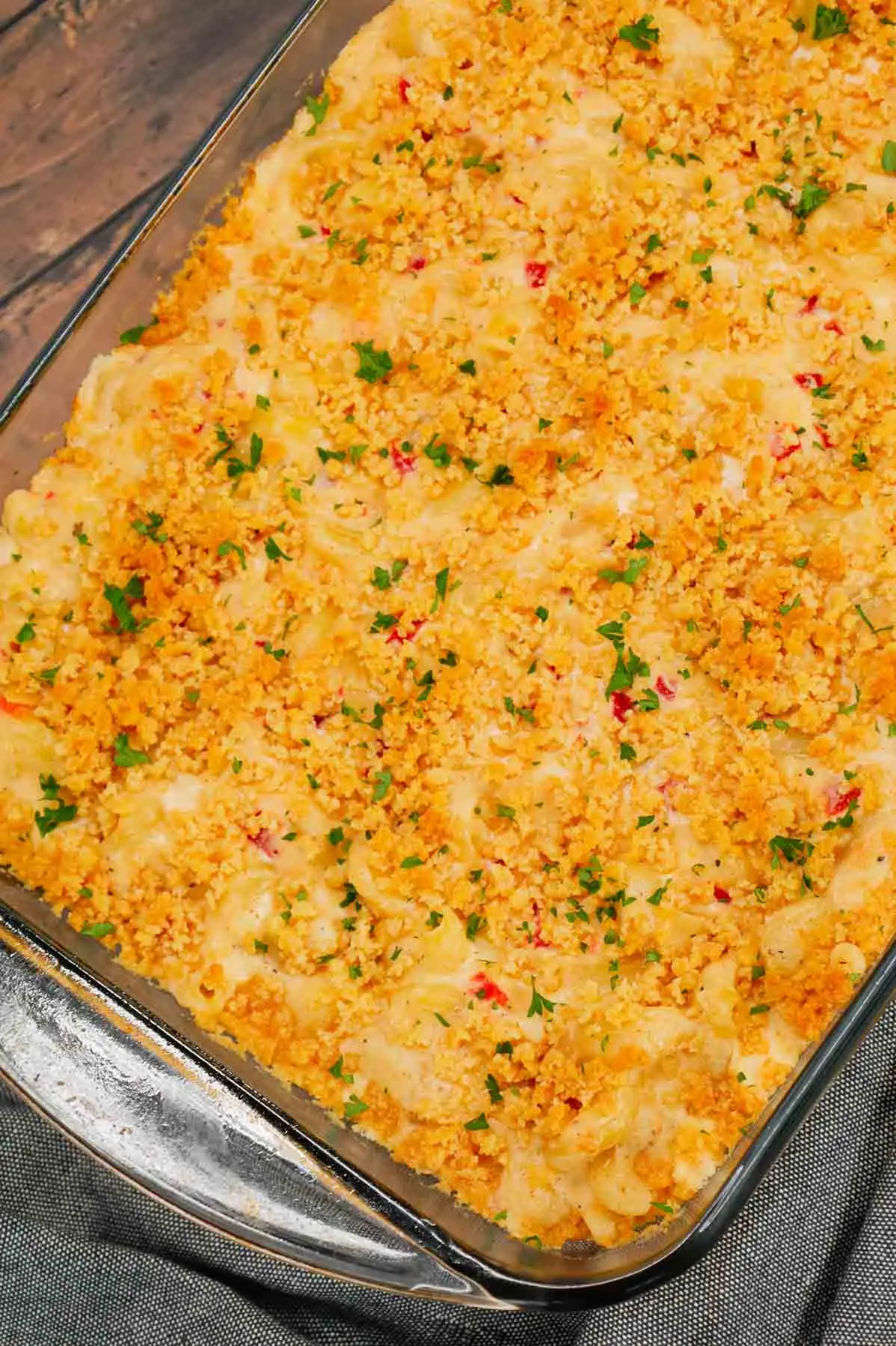Pimento Mac and Cheese is a delicious creamy pasta recipe loaded with white cheddar, cream cheese and diced pimentos and baked with a buttery Ritz cracker topping.
