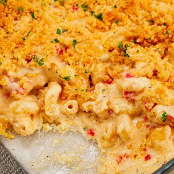 Pimento Mac and Cheese is a delicious creamy pasta recipe loaded with white cheddar, cream cheese and diced pimentos and baked with a buttery Ritz cracker topping.