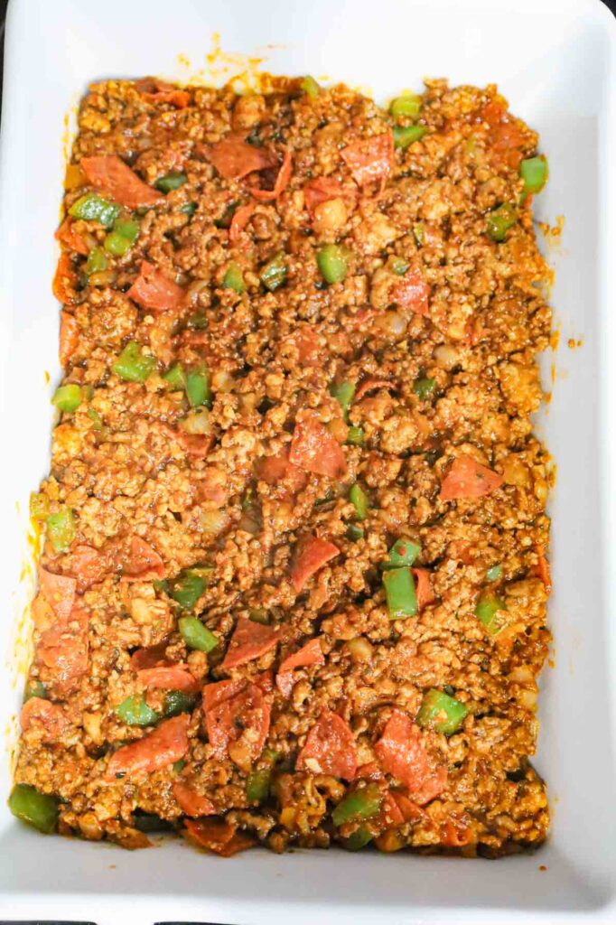 pizza ground meat mixture in a baking dish