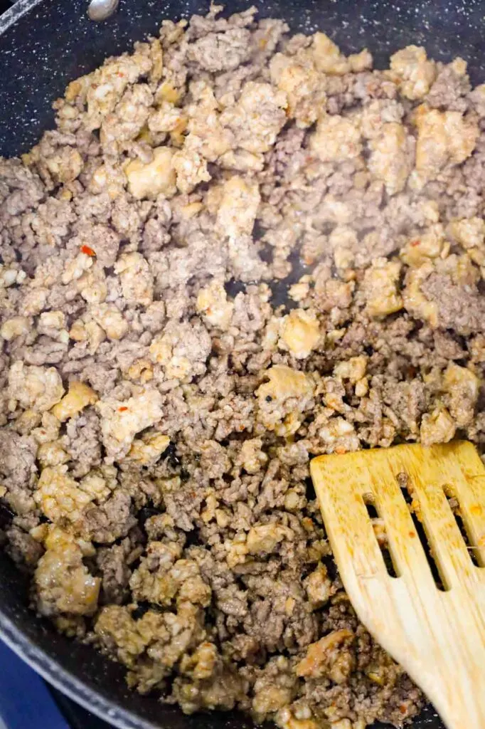 cooked ground beef and sausage meat in a skillet