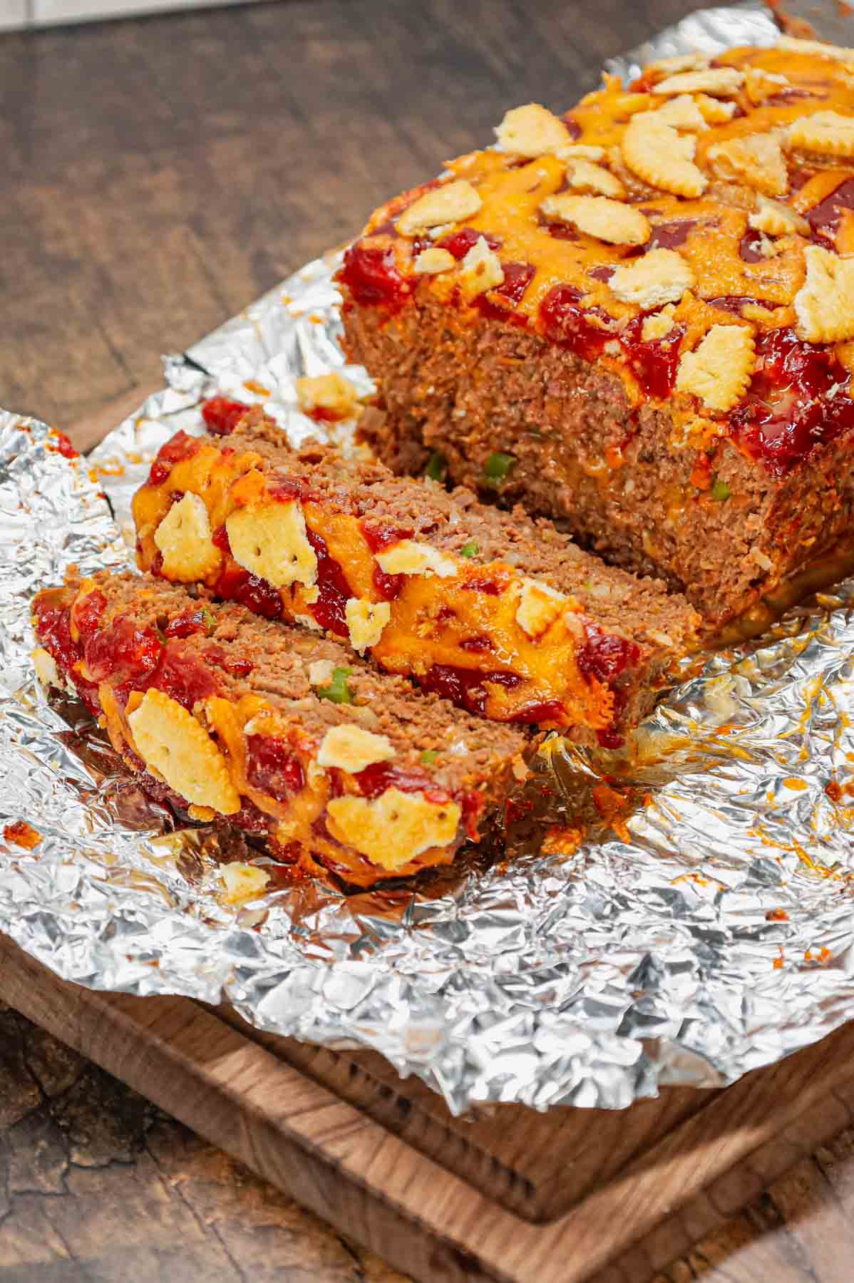 Ritz Cracker Meatloaf is a delicious ground beef meatloaf loaded with crushed Ritz crackers, onion soup mix, onions, green bell peppers and cheddar cheese.