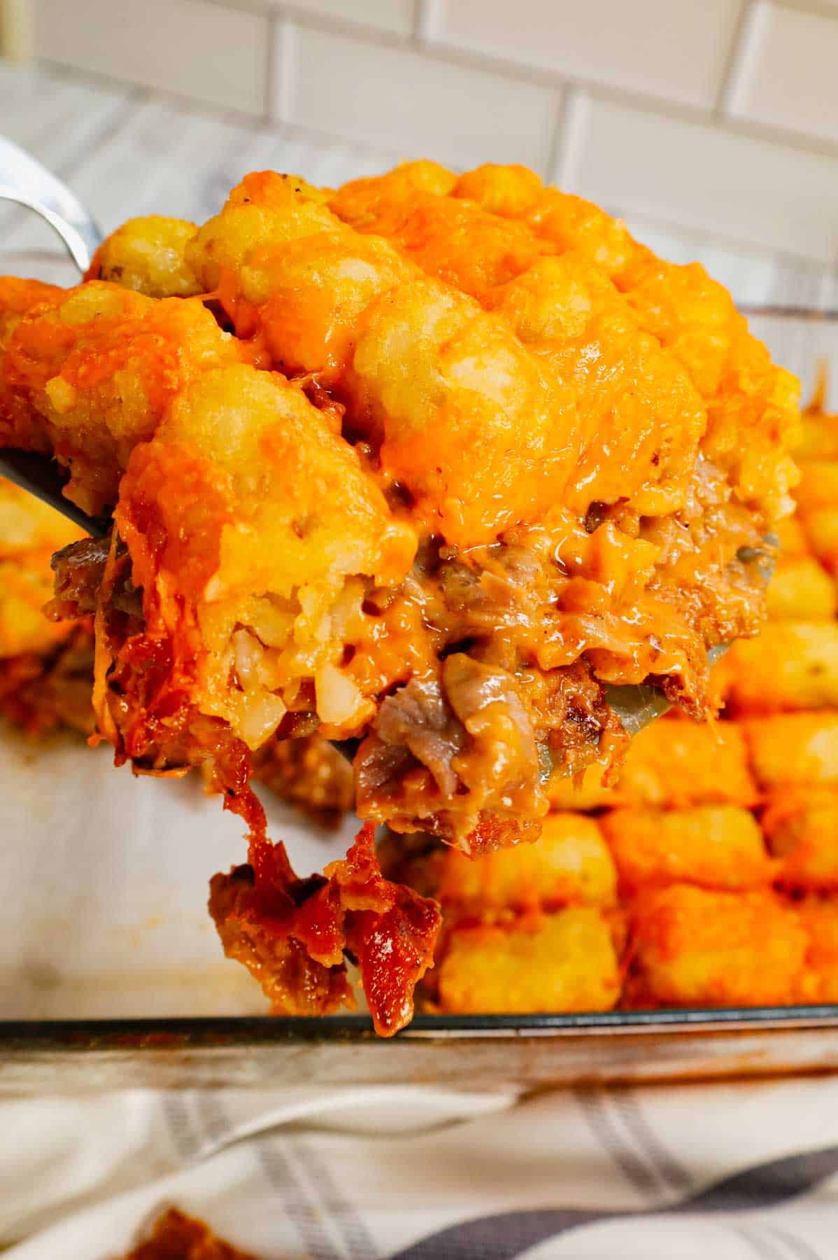 Roast Beef and Cheddar Tater Tot Casserole is a hearty dish loaded with deli roast beef, shredded cheddar cheese, cheddar soup, French's crispy fried onions and tater tots.