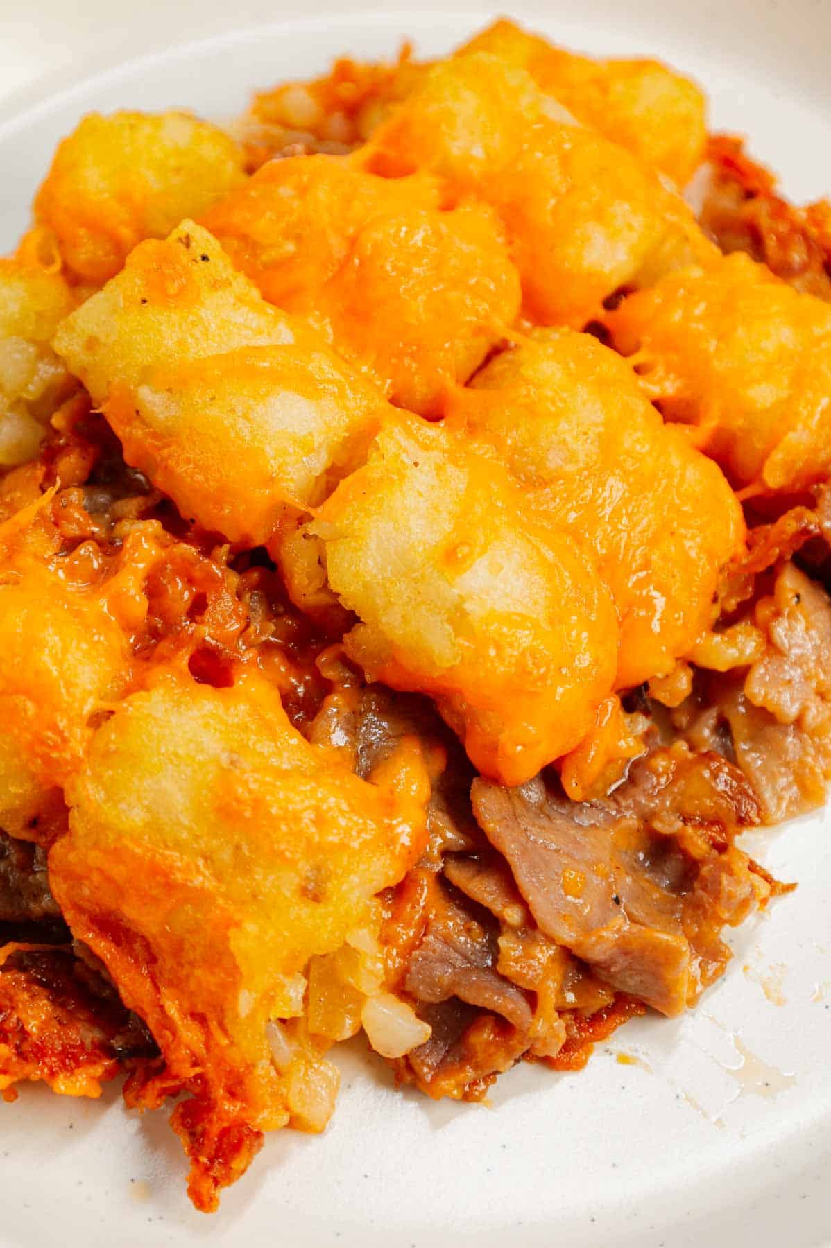 Roast Beef and Cheddar Tater Tot Casserole is a hearty dish loaded with deli roast beef, shredded cheddar cheese, cheddar soup, French's crispy fried onions and tater tots.