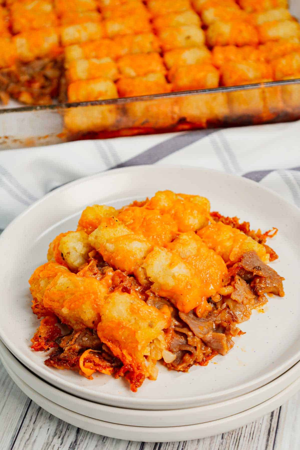 Roast Beef and Cheddar Tater Tot Casserole is a hearty dish loaded with deli roast beef, shredded cheddar cheese, cheddar soup, French's crispy fried onions and tater tots.