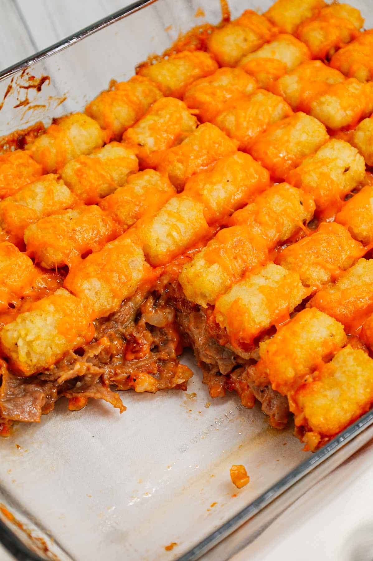 Roast Beef and Cheddar Tater Tot Casserole is a hearty dish loaded with deli roast beef, shredded cheddar cheese, cheddar soup, French's crispy fried onions and tater tots.