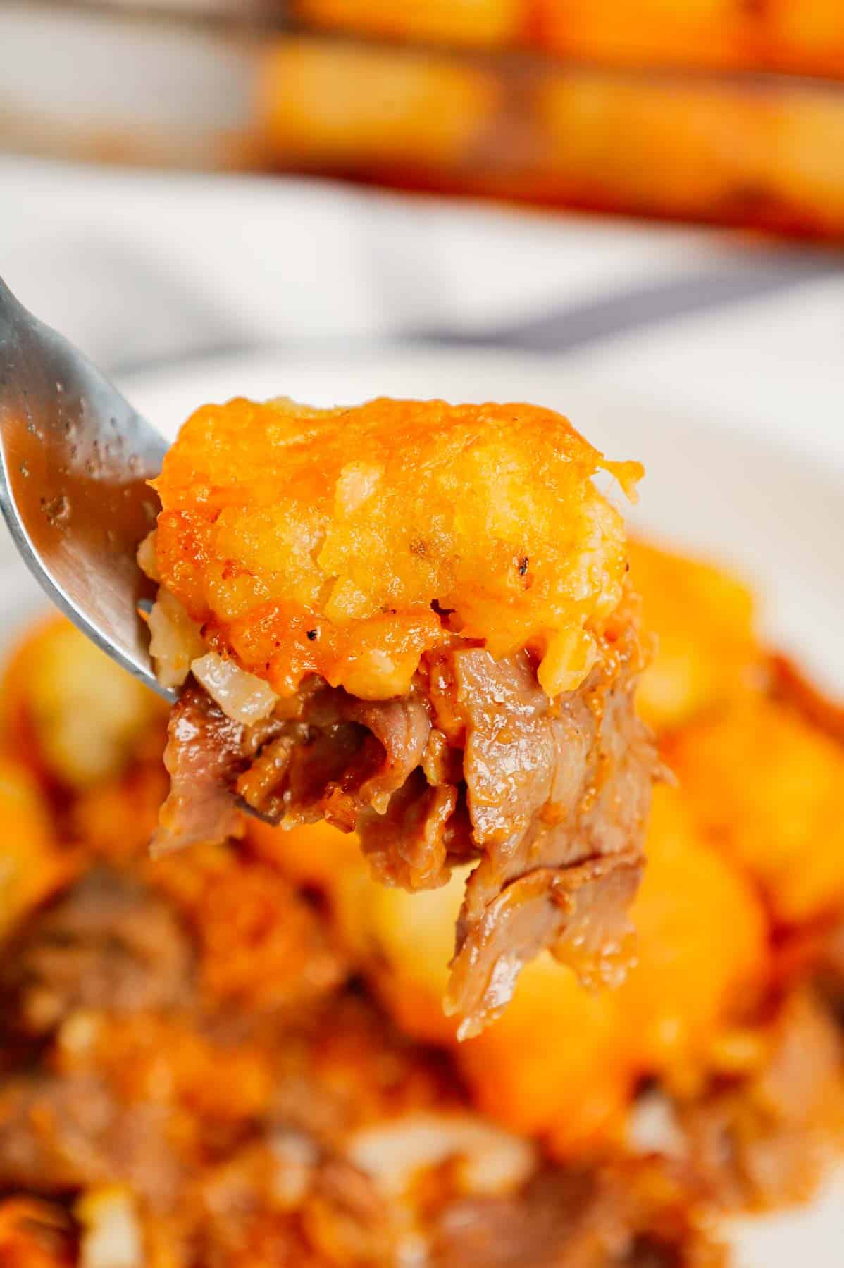 Roast Beef and Cheddar Tater Tot Casserole is a hearty dish loaded with deli roast beef, shredded cheddar cheese, cheddar soup, French's crispy fried onions and tater tots.