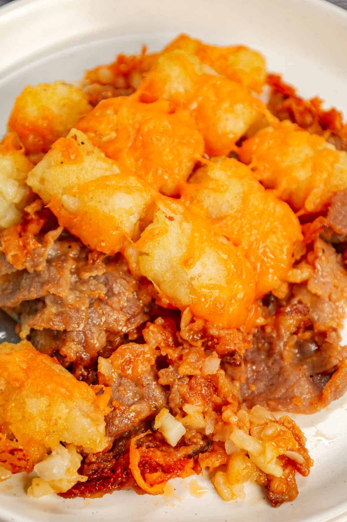 Roast Beef and Cheddar Tater Tot Casserole is a hearty dish loaded with deli roast beef, shredded cheddar cheese, cheddar soup, French's crispy fried onions and tater tots.