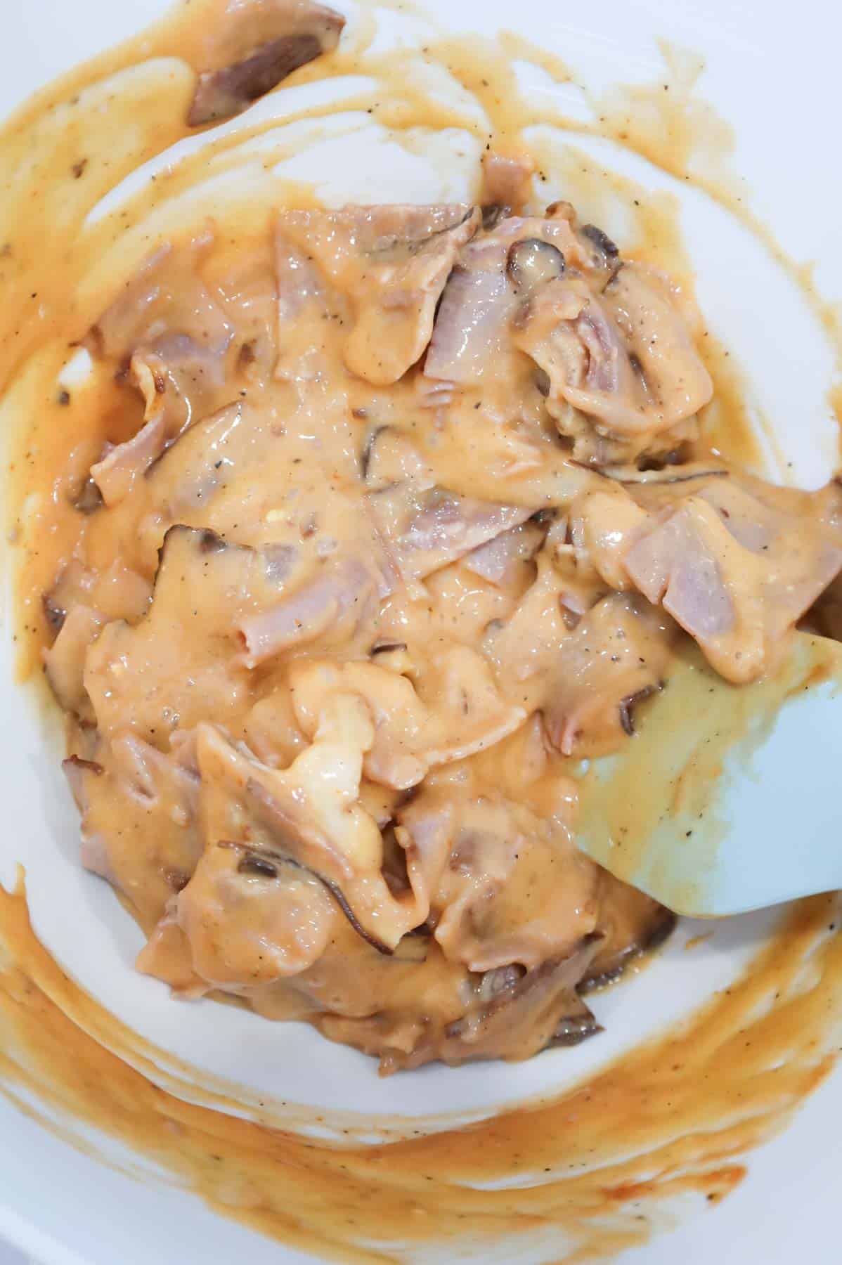 roast beef and cheddar soup mixture in a mixing bowl