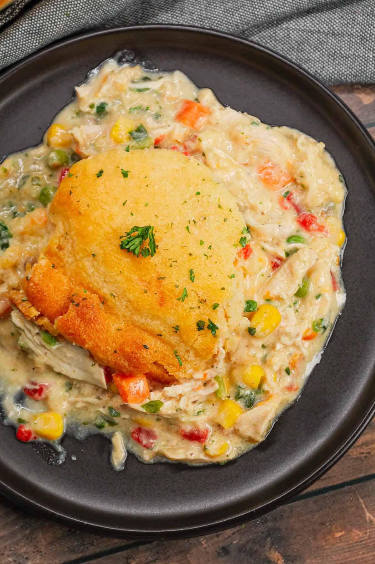 Chicken Cobbler is a hearty dish loaded with shredded rotisserie chicken and veggies all tossed in a mixture of cream of chicken and cream of mushroom soup and topped with Red Lobster Cheddar Bay biscuit mix.
