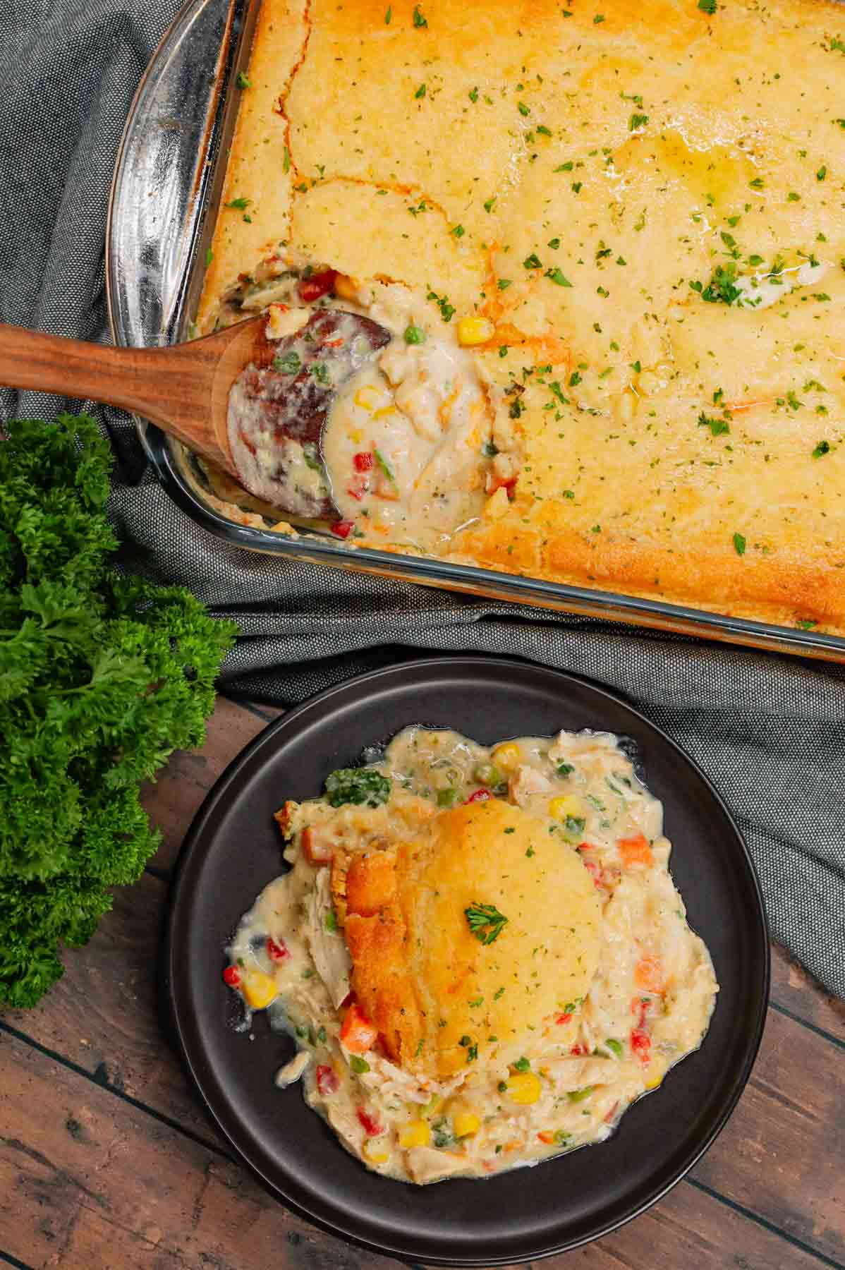 Chicken Cobbler is a hearty dish loaded with shredded rotisserie chicken and veggies all tossed in a mixture of cream of chicken and cream of mushroom soup and topped with Red Lobster Cheddar Bay biscuit mix.