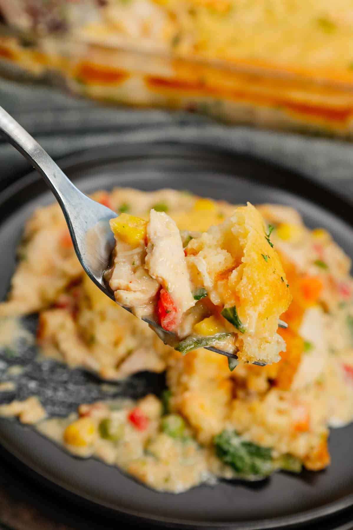 Chicken Cobbler is a hearty dish loaded with shredded rotisserie chicken and veggies all tossed in a mixture of cream of chicken and cream of mushroom soup and topped with Red Lobster Cheddar Bay biscuit mix.