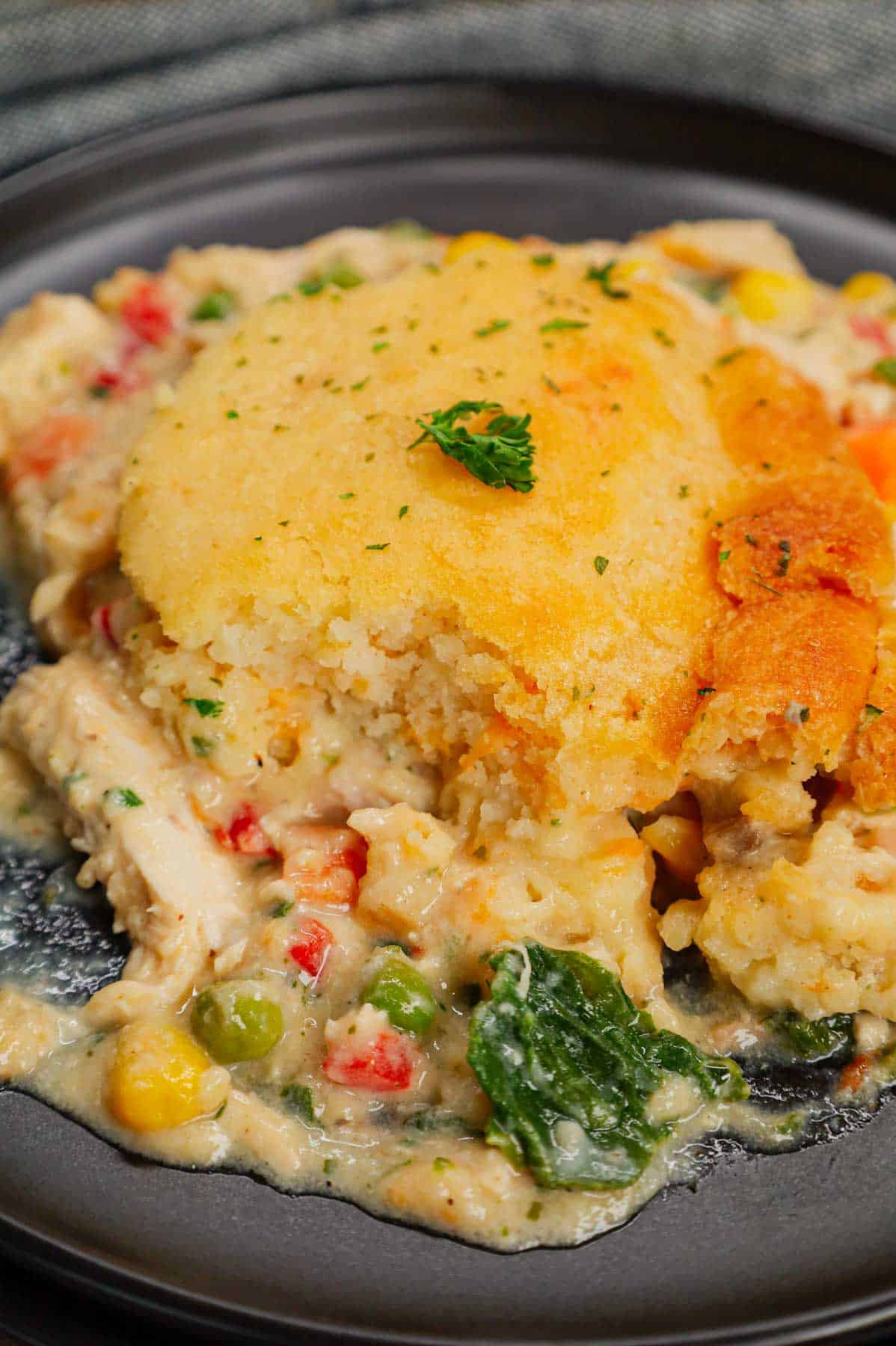 Chicken Cobbler is a hearty dish loaded with shredded rotisserie chicken and veggies all tossed in a mixture of cream of chicken and cream of mushroom soup and topped with Red Lobster Cheddar Bay biscuit mix.