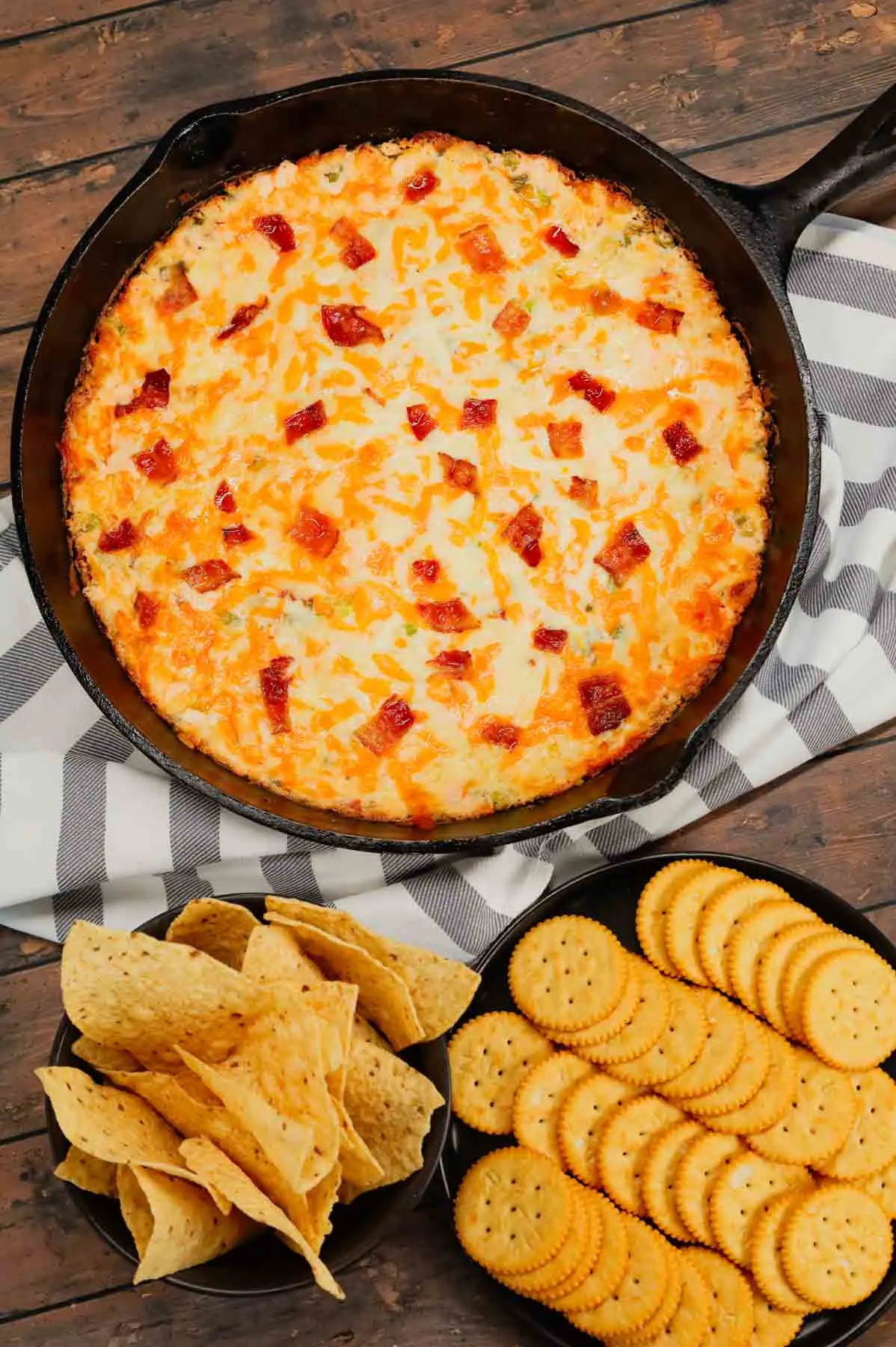 Crack Chicken Dip is a delicious baked dip loaded with shredded chicken, cream cheese, ranch dressing, bacon, green onions and cheddar cheese.