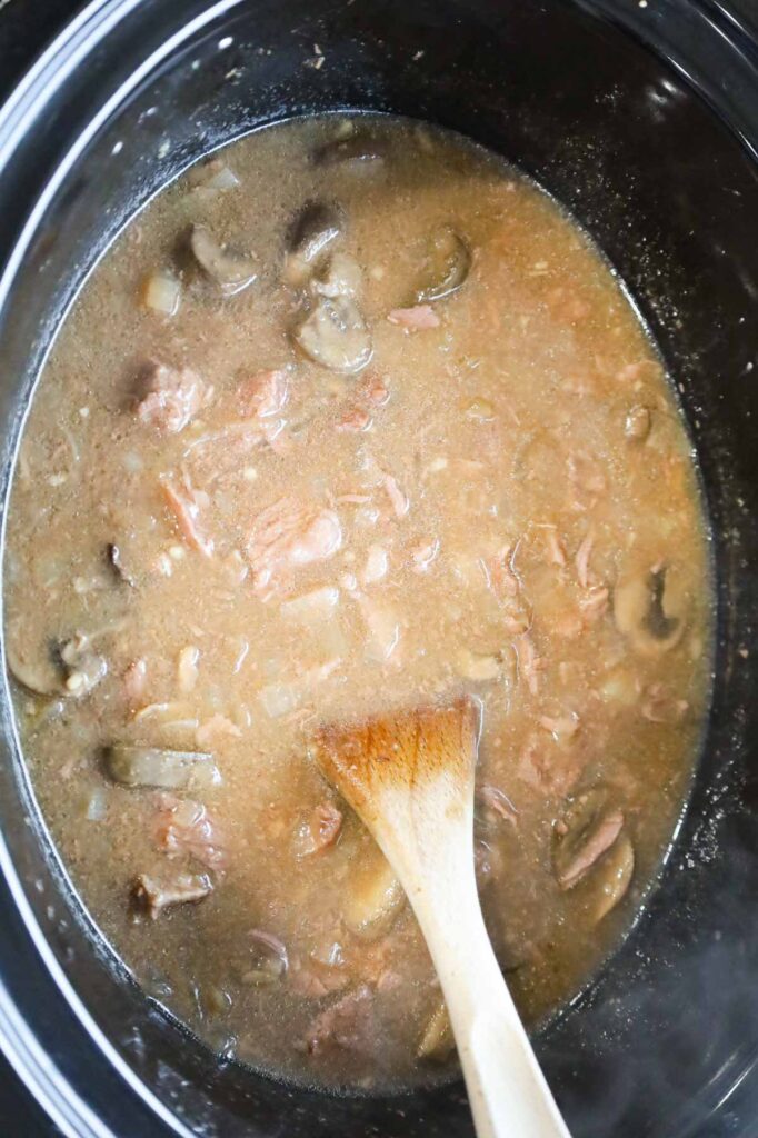 stirring beef stroganoff after slow cooking