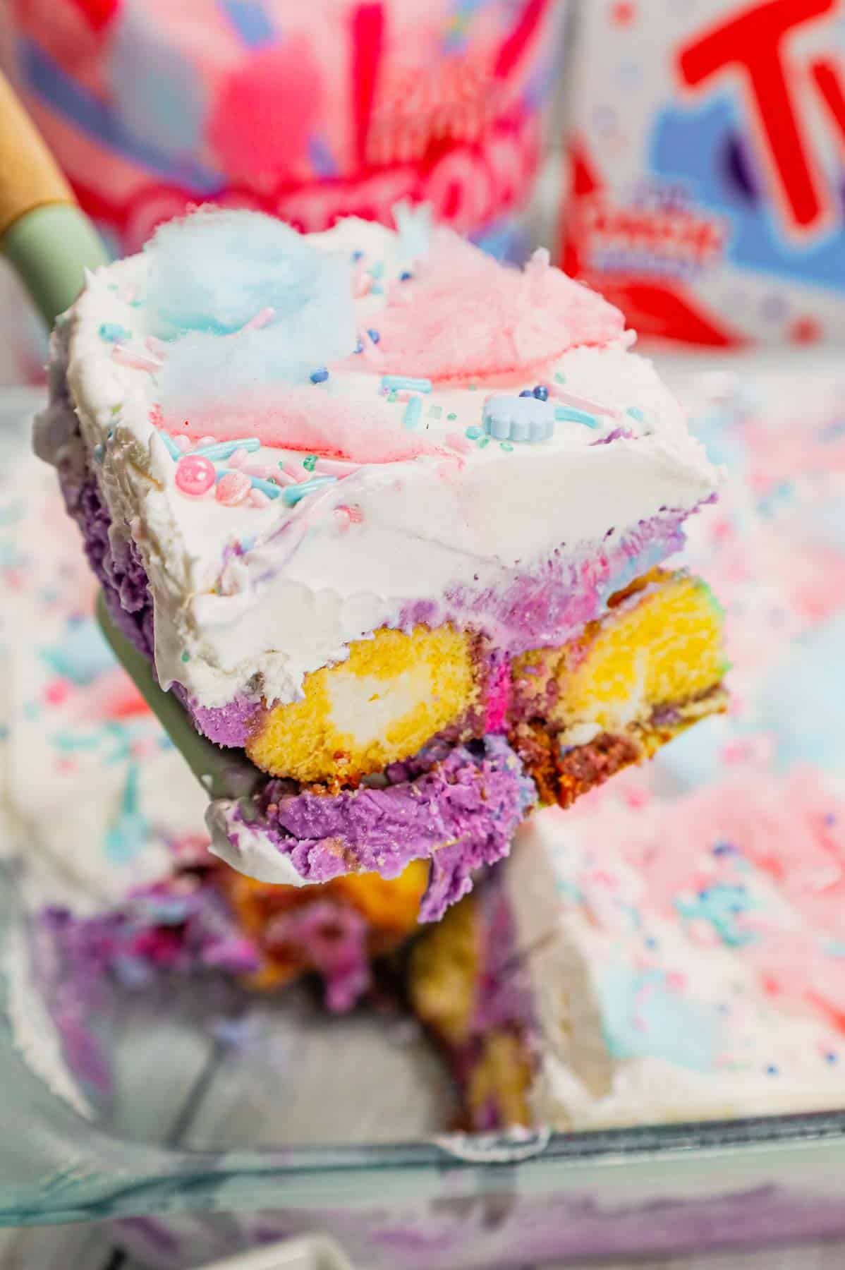 Cotton Candy Ice Cream Cake is an easy summer dessert recipe made with Twinkies, cotton candy ice cream, Cool Whip, cotton candy and sprinkles.