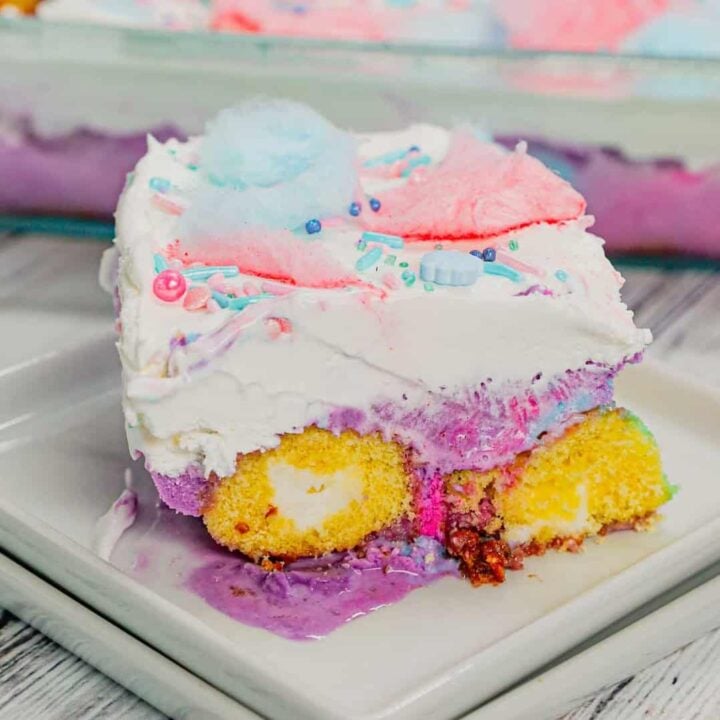 Cotton Candy Ice Cream Cake is an easy summer dessert recipe made with Twinkies, cotton candy ice cream, Cool Whip, cotton candy and sprinkles.