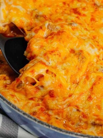 Cheeseburger Tortellini Skillet is a hearty pasta dish loaded with ground beef, frozen cheese tortellini, diced onions, cheddar soup, Rotel and shredded cheddar cheese.
