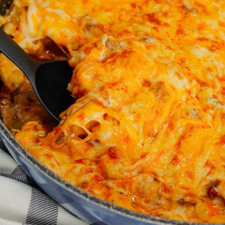 Cheeseburger Tortellini Skillet is a hearty pasta dish loaded with ground beef, frozen cheese tortellini, diced onions, cheddar soup, Rotel and shredded cheddar cheese.