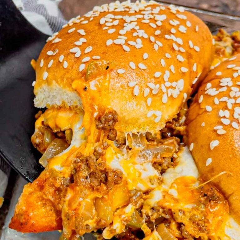 Chopped Cheeseburger Casserole is an easy dish loaded with ground beef, diced onions, pickles, ketchup, mustard, sesame seeds, cheddar cheese and hamburger buns.