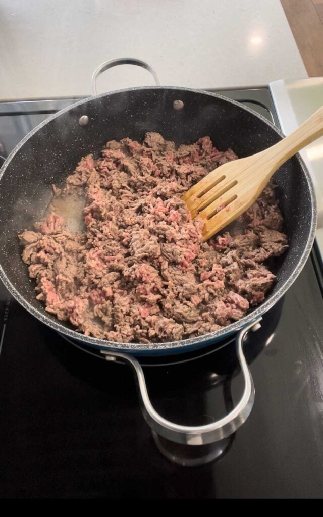 ground beef cooking in a skillet