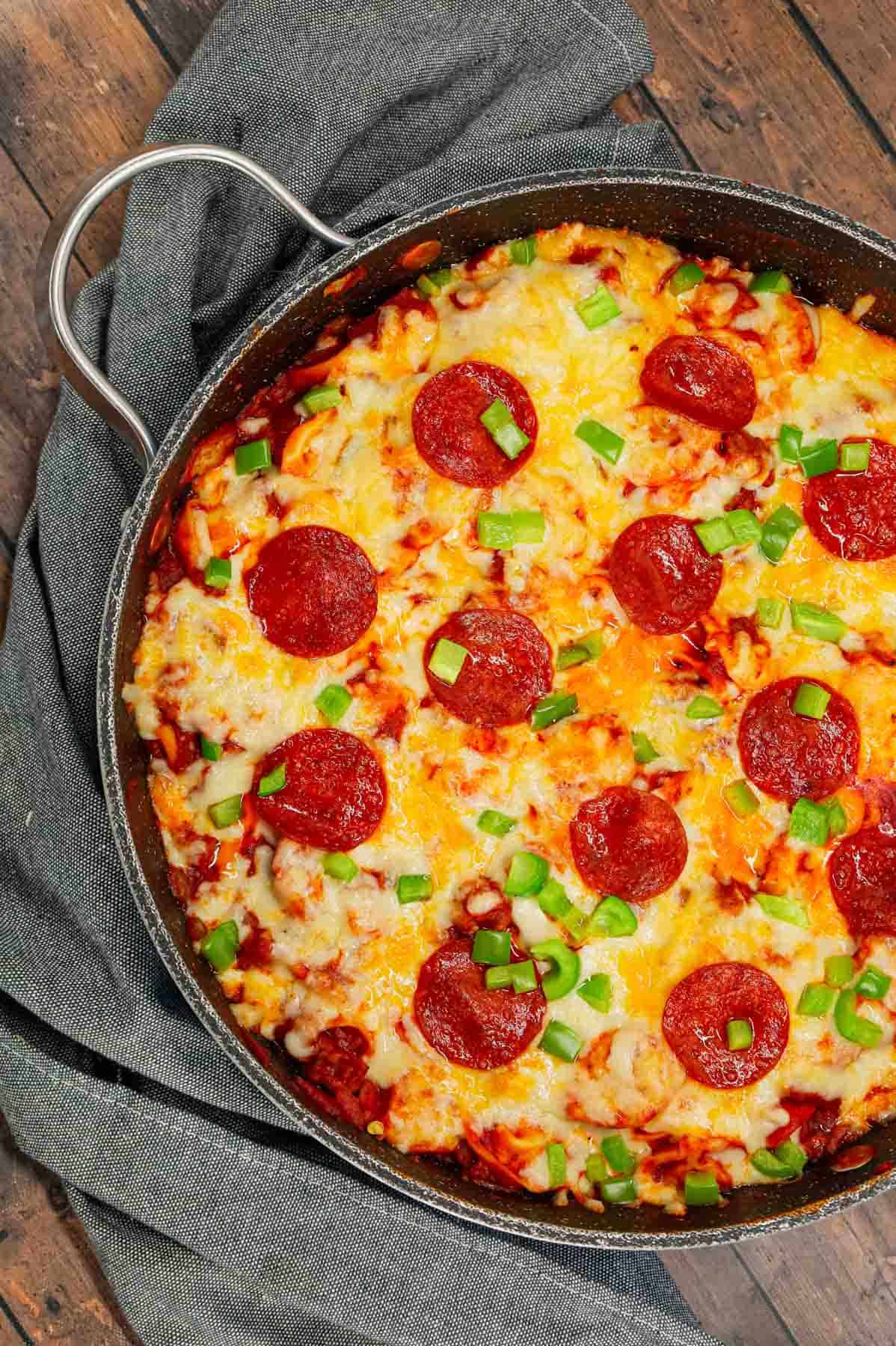 Pizza Tortellini is a hearty pasta dish loaded with Italian sausage meat, cheese tortellini, diced onions, green peppers, pepperoni, pizza sauce, pasta sauce and mozzarella cheese.
