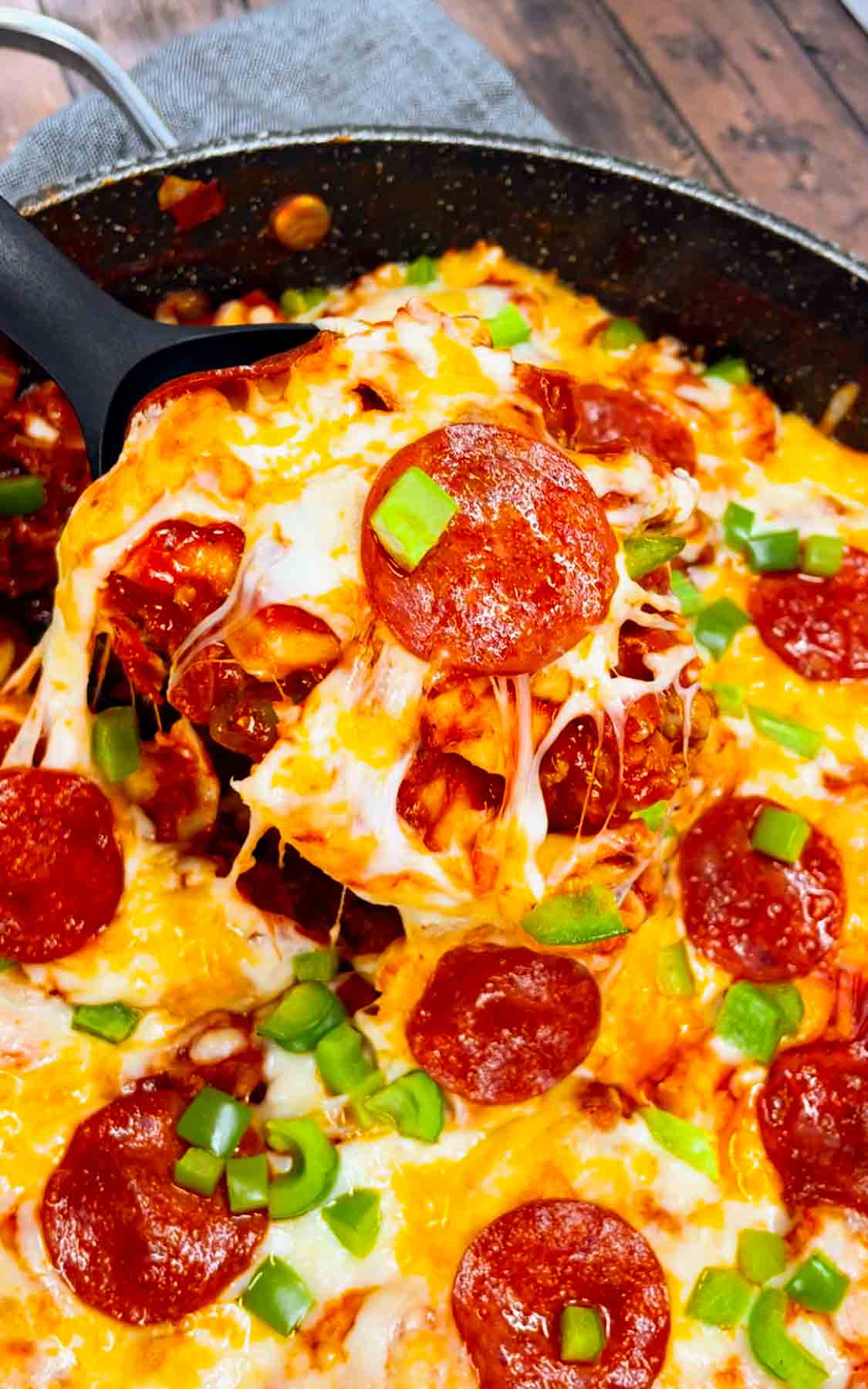 Pizza Tortellini is a hearty pasta dish loaded with Italian sausage meat, cheese tortellini, diced onions, green peppers, pepperoni, pizza sauce, pasta sauce and mozzarella cheese.