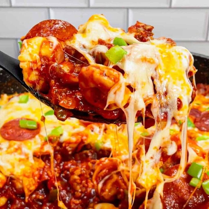 Pizza Tortellini is a hearty pasta dish loaded with Italian sausage meat, cheese tortellini, diced onions, green peppers, pepperoni, pizza sauce, pasta sauce and mozzarella cheese.
