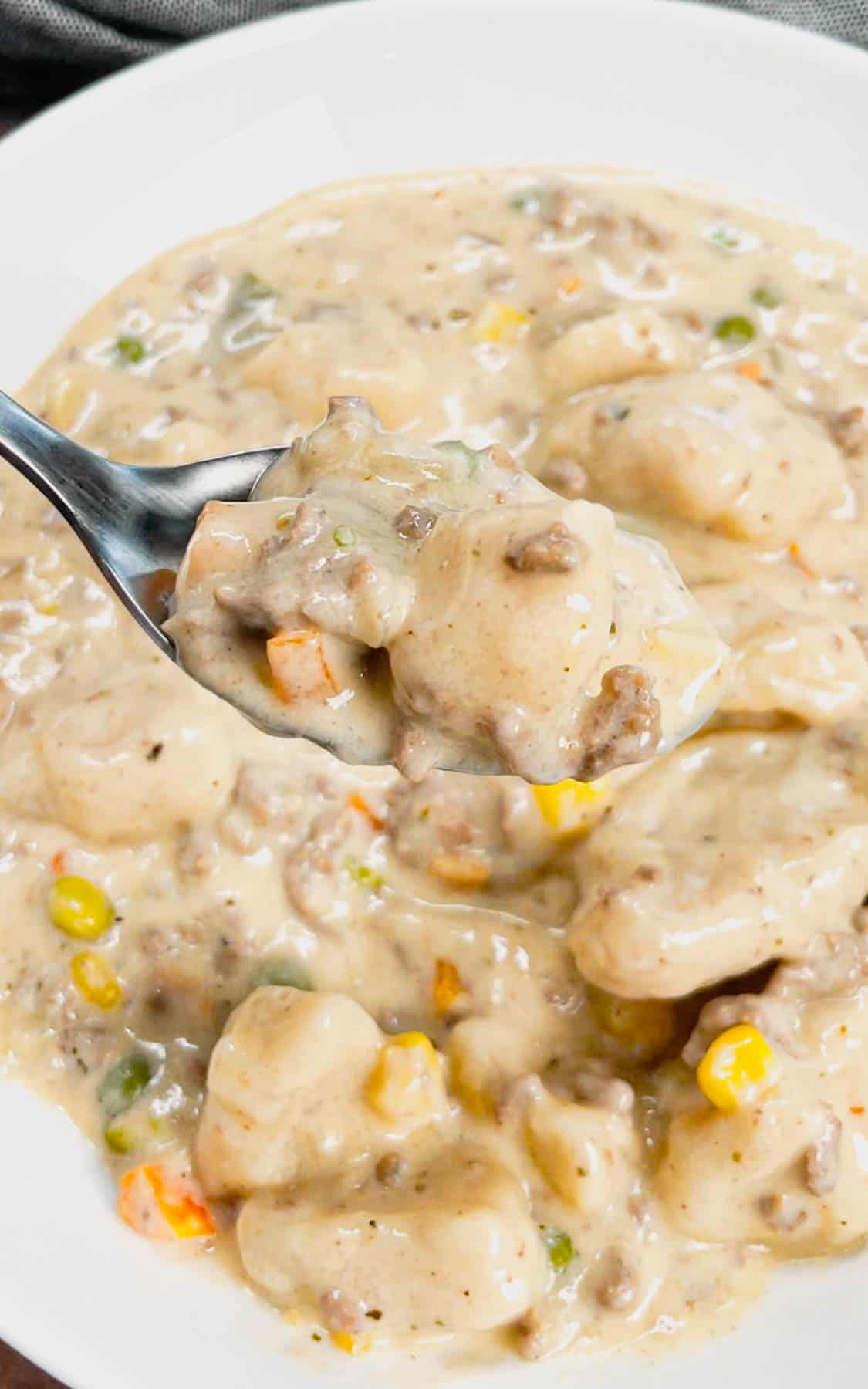 Ground Beef and Dumplings is a delicious comfort dish loaded with ground beef, mixed veggies and Pillsbury biscuit dumplings all cooked in a creamy and flavourful soup mixture.
