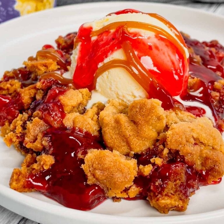 Peanut Butter and Jelly Cobbler is an easy 3 ingredient dessert recipe using strawberry pie filling, butter and peanut butter cookie mix.