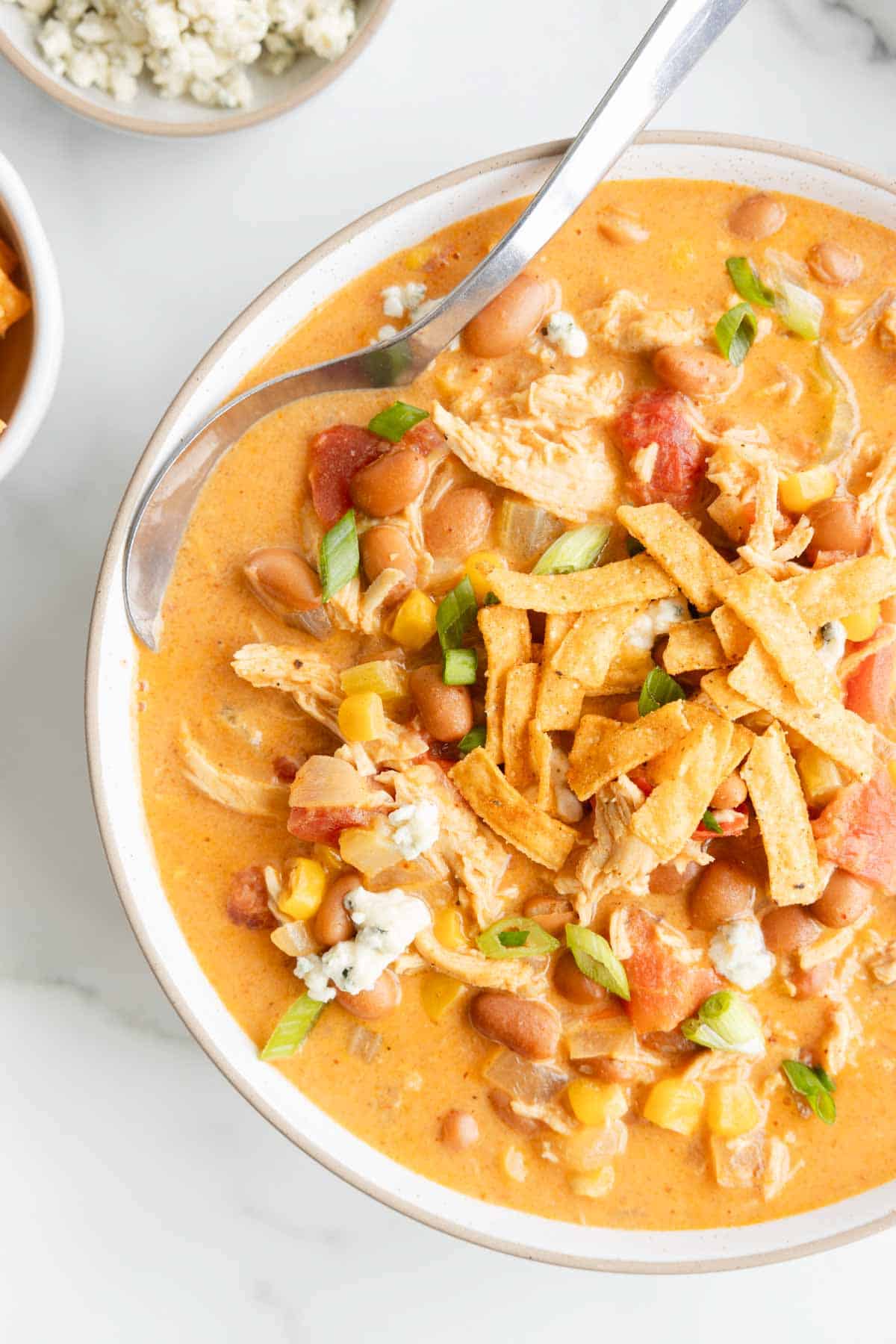 Craving the hearty warmth of chili with a spicy twist? This Buffalo Chicken Chili combines zesty buffalo flavor with tender chicken and creamy beans, creating a cozy bowl that’s sure to heat up your taste buds and become a new game-day favorite! This recipe is loaded with pinto beans, cream cheese, celery, chicken breast, corn, Buffalo sauce and diced tomatoes.