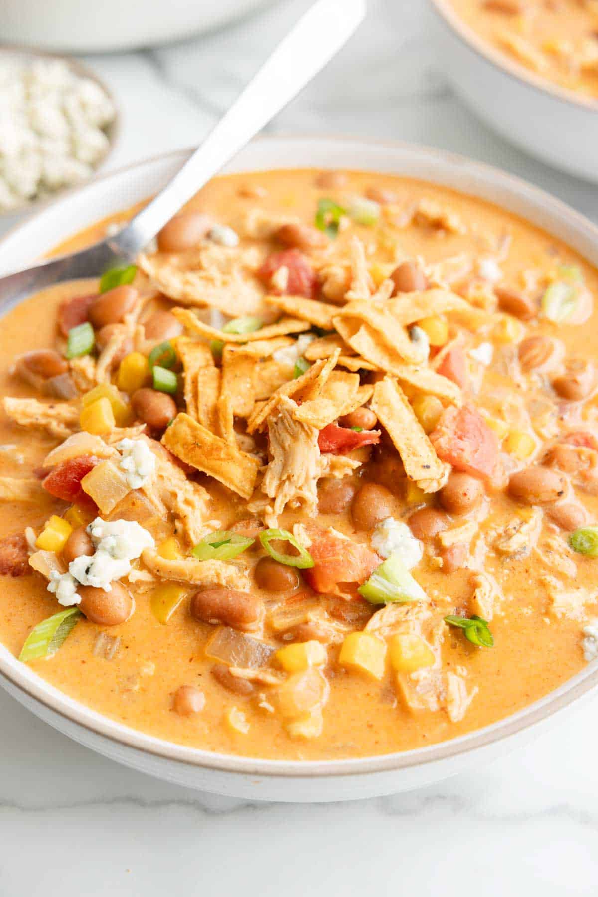 Craving the hearty warmth of chili with a spicy twist? This Buffalo Chicken Chili combines zesty buffalo flavor with tender chicken and creamy beans, creating a cozy bowl that’s sure to heat up your taste buds and become a new game-day favorite! This recipe is loaded with pinto beans, cream cheese, celery, chicken breast, corn, Buffalo sauce and diced tomatoes.